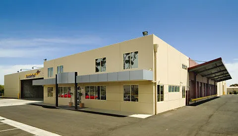 Tilt-up concrete commercial building under construction by Bravo Building Co.
